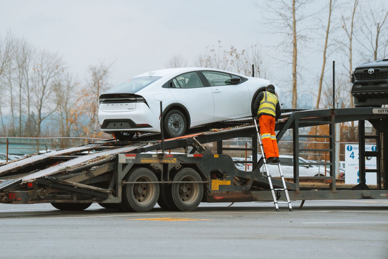 New car being loaded onto a car carrier